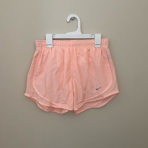 Pink Nike running shorts
